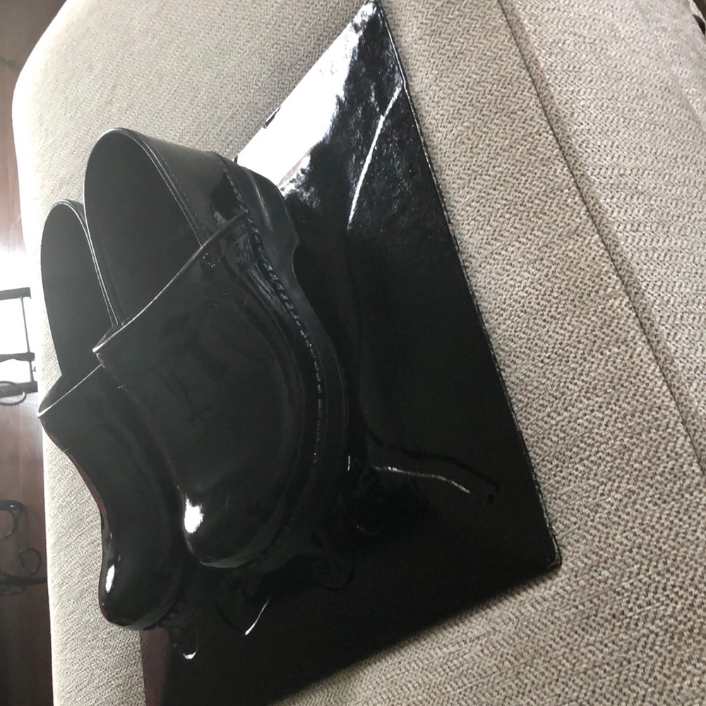 Black on black patent leather clogs
